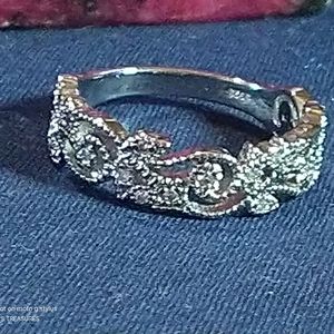 DIAMOND ACCENTED STERLING, SWIRLS, PETALS, LOOPS AND LEAVES RING. SIZE 8.5